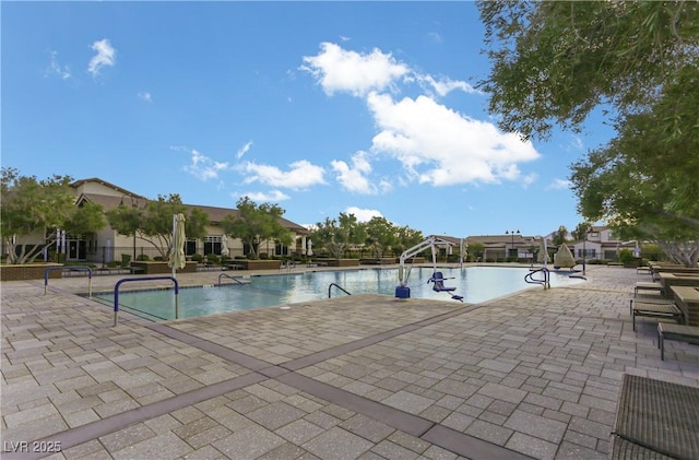 view of pool featuring a patio area