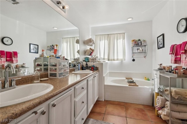 6527 Netherseal Ave, Las Vegas, NV 89139 - bathroom featuring vanity, tile patterned floors, and tiled bath