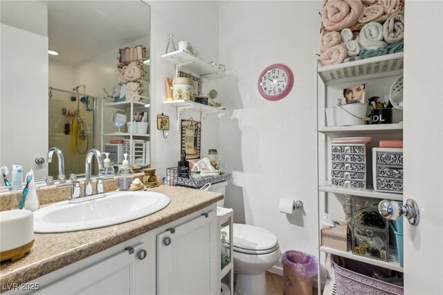 6527 Netherseal Ave, Las Vegas, NV 89139 - bathroom featuring vanity, toilet, and a shower with shower door