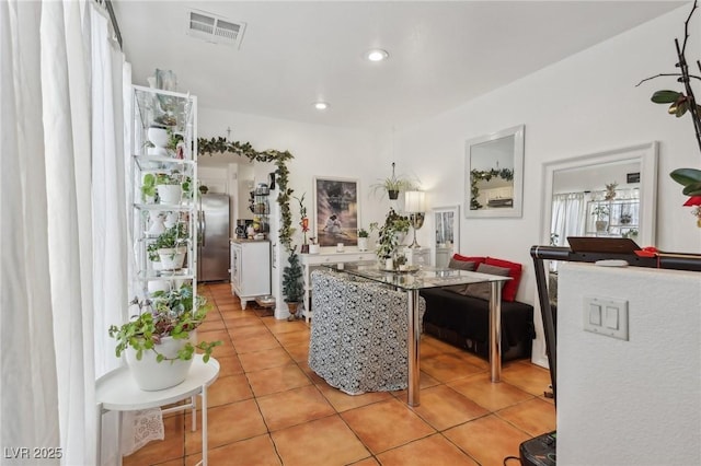 6527 Netherseal Ave, Las Vegas, NV 89139 - kitchen featuring stainless steel refrigerator and light tile patterned flooring