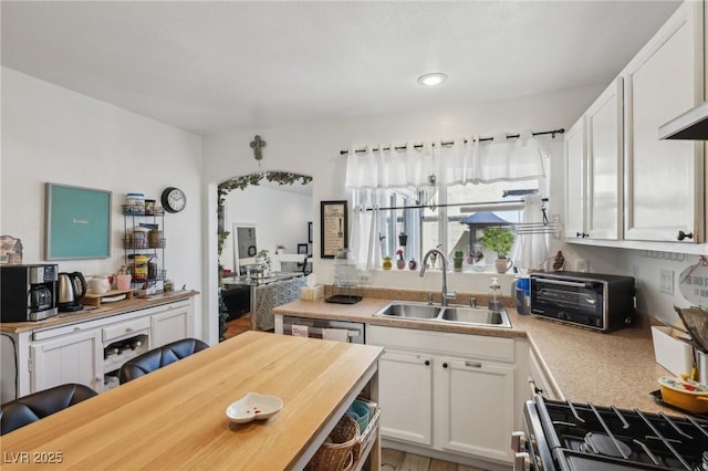 6527 Netherseal Ave, Las Vegas, NV 89139 - kitchen featuring stainless steel appliances, sink, and white cabinets