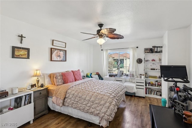 6527 Netherseal Ave, Las Vegas, NV 89139 - bedroom with dark wood-type flooring, ceiling fan, and a textured ceiling
