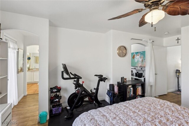 6527 Netherseal Ave, Las Vegas, NV 89139 - bedroom with ceiling fan, connected bathroom, and light hardwood / wood-style flooring
