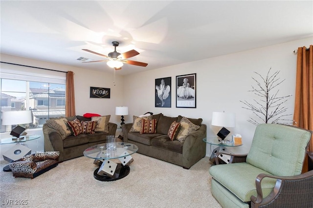 carpeted living room featuring ceiling fan