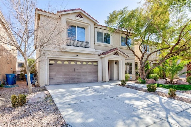 mediterranean / spanish-style home featuring a garage