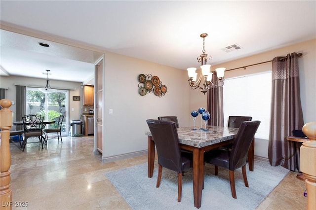 dining area featuring a chandelier