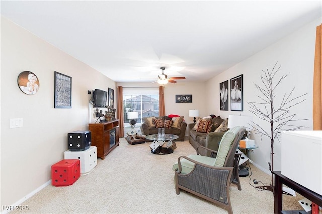 living room featuring carpet floors and ceiling fan