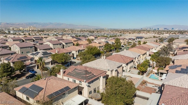 birds eye view of property featuring a mountain view