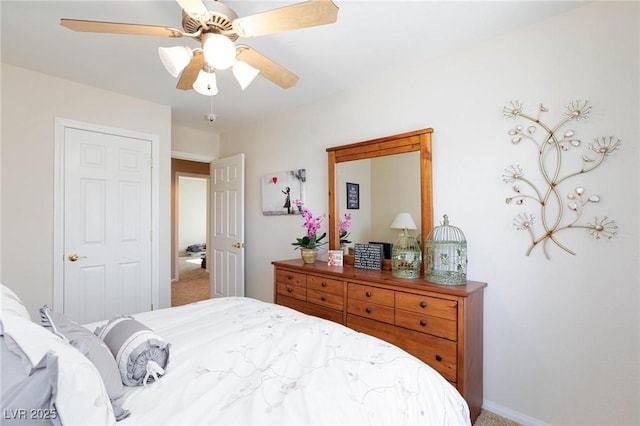 carpeted bedroom featuring ceiling fan