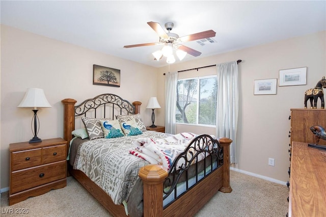 bedroom featuring light carpet and ceiling fan