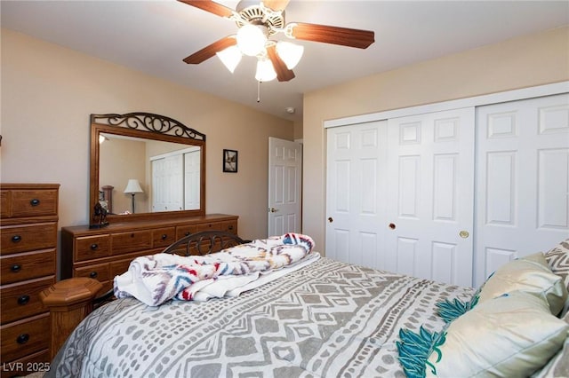 bedroom featuring ceiling fan and a closet