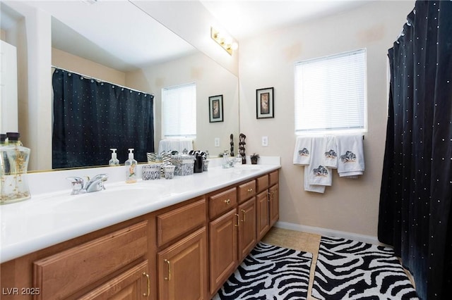 bathroom with tile patterned flooring and vanity