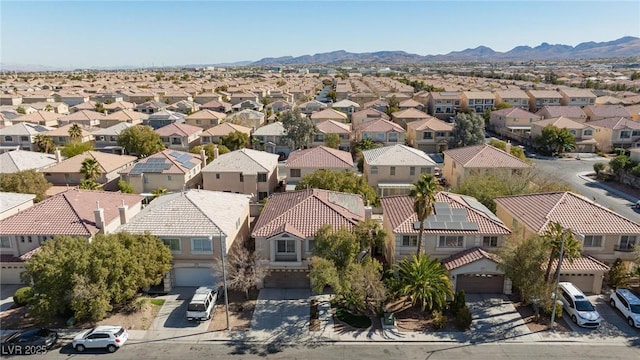 birds eye view of property featuring a mountain view