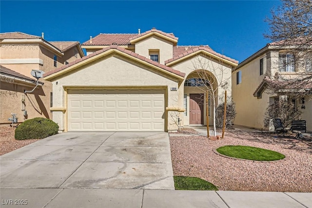 mediterranean / spanish-style home featuring a garage