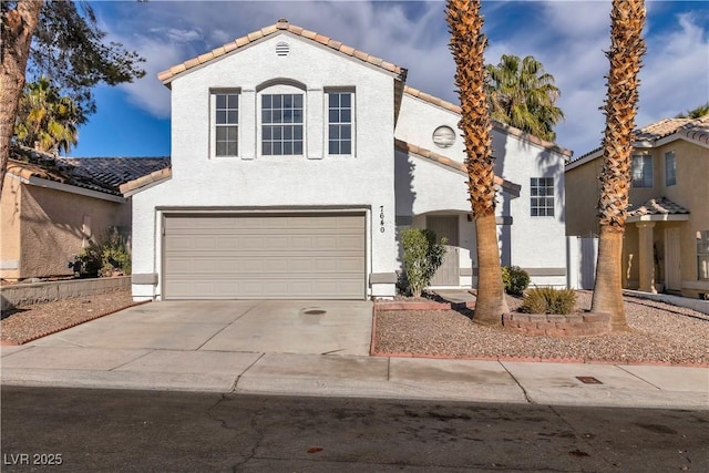 view of front of property with a garage