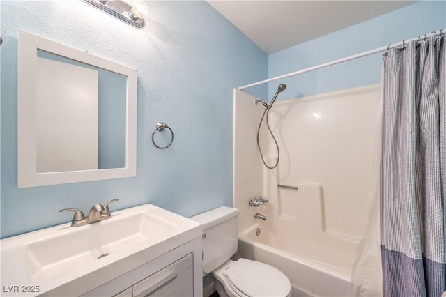 bathroom with toilet, shower / bath combo with shower curtain, and vanity