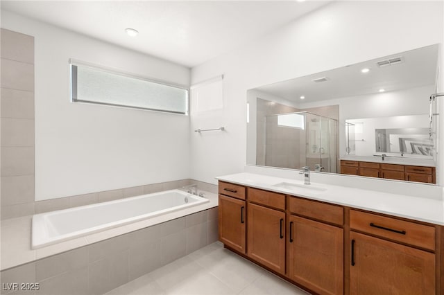 bathroom featuring vanity, tile patterned flooring, and independent shower and bath