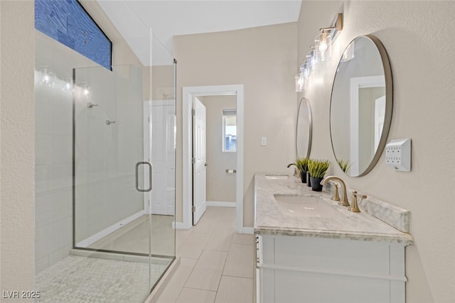 bathroom featuring vanity and walk in shower