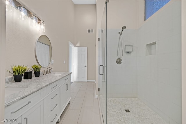 bathroom with vanity and an enclosed shower