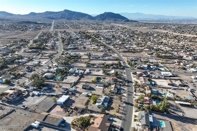 birds eye view of property featuring a mountain view