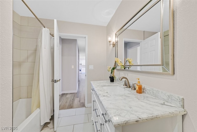 bathroom featuring vanity, tile patterned flooring, and shower / bath combo with shower curtain