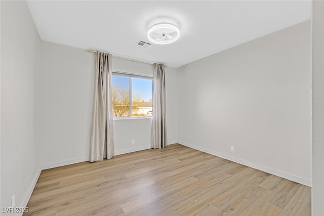 unfurnished room featuring light wood-type flooring