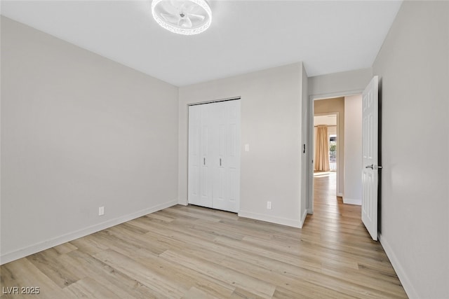 unfurnished bedroom with light wood-type flooring