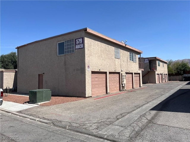 view of property exterior with a garage