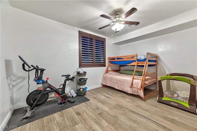 bedroom featuring light hardwood / wood-style flooring and ceiling fan