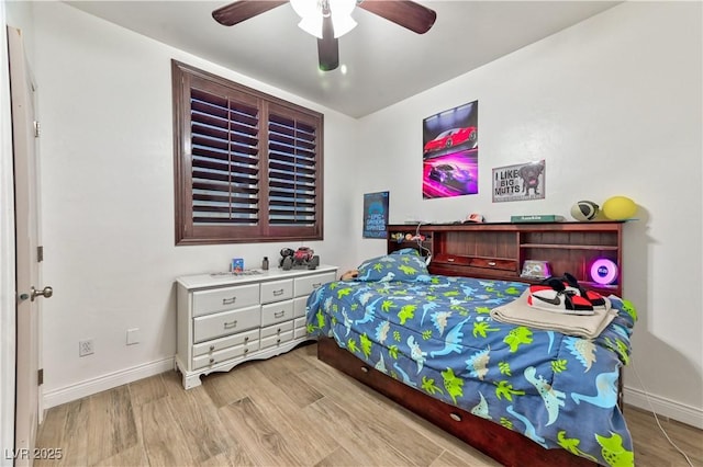 bedroom with ceiling fan and light wood-type flooring