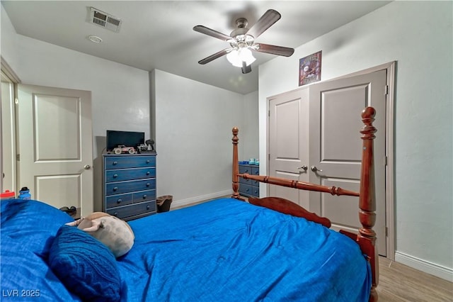 bedroom featuring ceiling fan and light hardwood / wood-style flooring