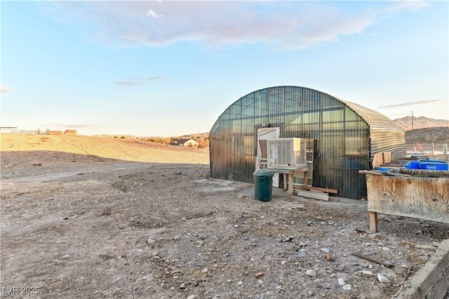 view of outbuilding with a mountain view