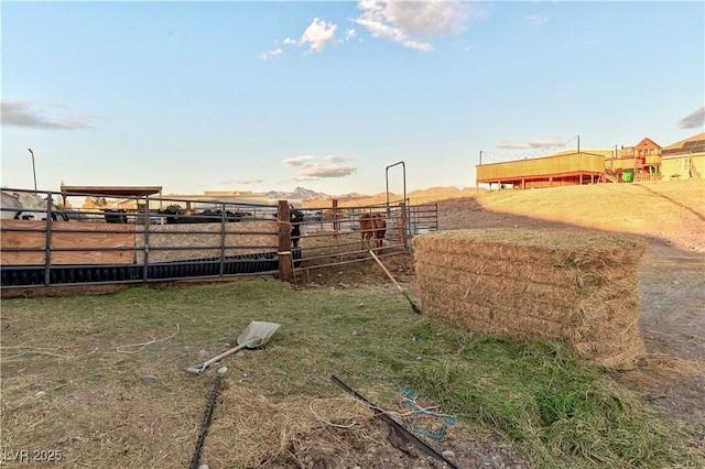 view of yard featuring an outbuilding and a rural view