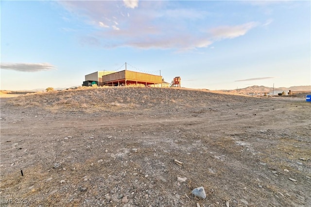 view of yard featuring a mountain view and a rural view