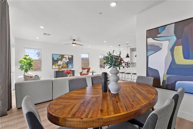 dining space featuring plenty of natural light, light hardwood / wood-style floors, and ceiling fan