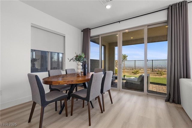 dining space featuring light hardwood / wood-style floors