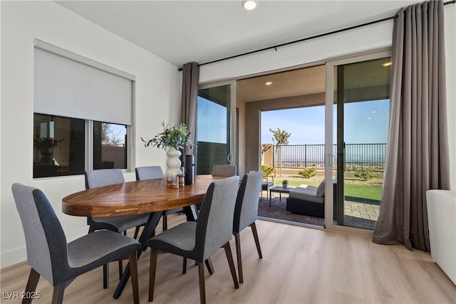 dining space featuring light wood-type flooring