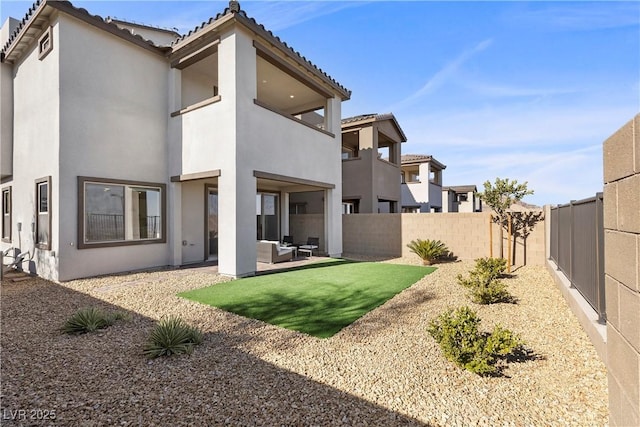 back of house with a patio