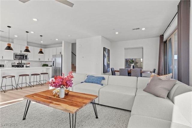 living room with light hardwood / wood-style flooring