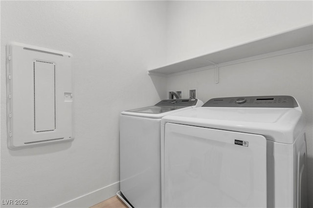 clothes washing area featuring washing machine and dryer