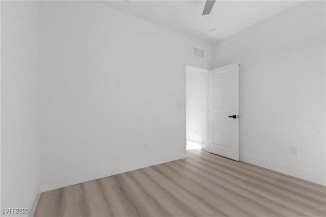 spare room with ceiling fan and light hardwood / wood-style flooring