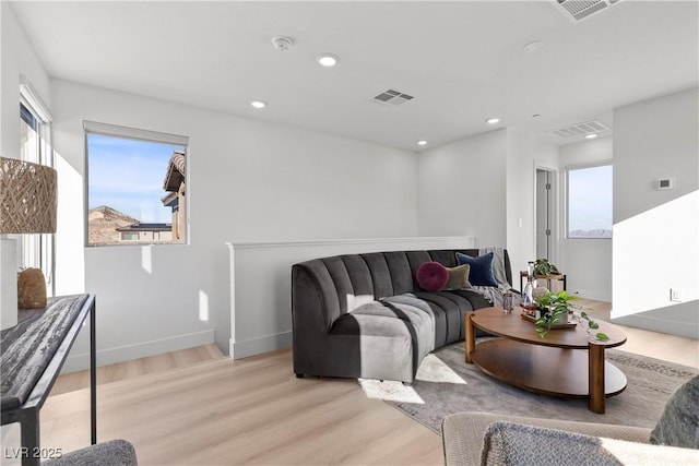 living room with light hardwood / wood-style floors