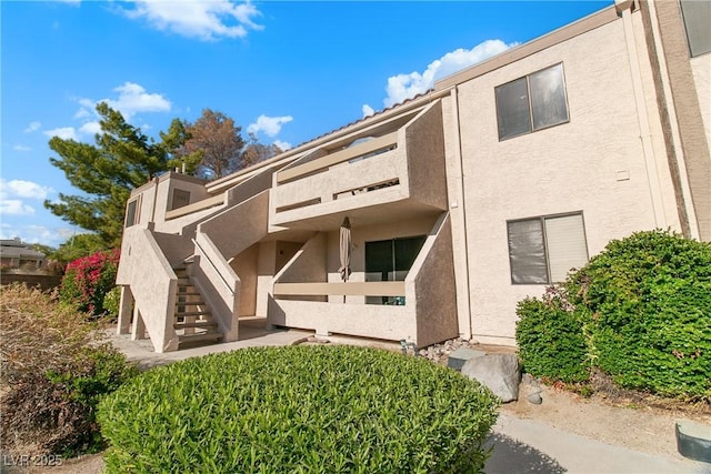 view of front of property with a balcony