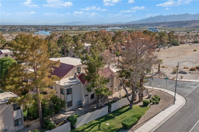 birds eye view of property with a mountain view