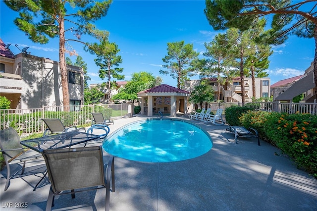 view of swimming pool featuring a gazebo and a patio