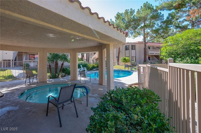 view of swimming pool featuring a patio