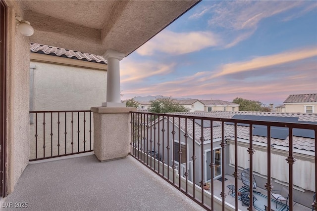 view of balcony at dusk