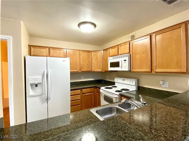 kitchen featuring sink and white appliances