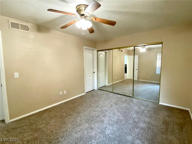 unfurnished bedroom with ceiling fan and carpet