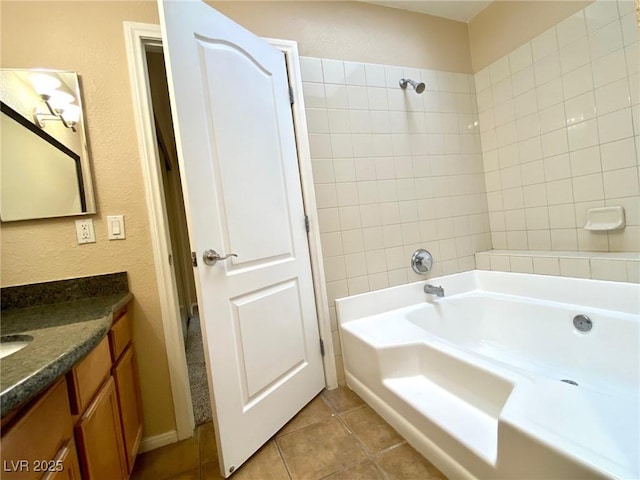 bathroom with vanity, a bath, and tile patterned floors